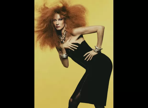 Gisele Bundchen appears drastically different on the cover of Vogue Italia, having dyed her hair red.