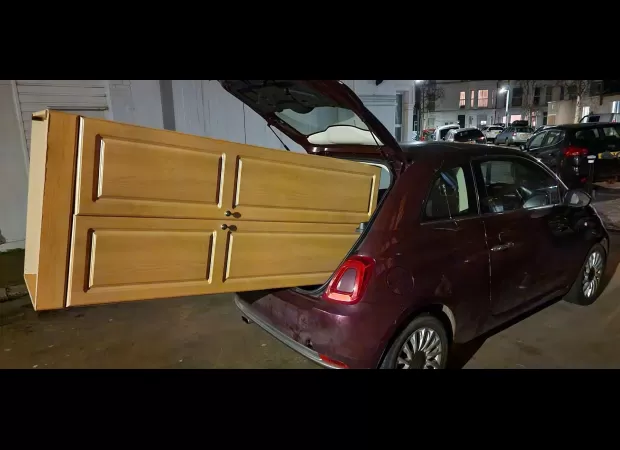 The driver believed that using his car to move his wardrobe would be a good idea.