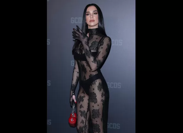 At Milan Fashion Week, Dua Lipa made a statement in a sheer lace bodystocking and black lingerie, impressing the audience.