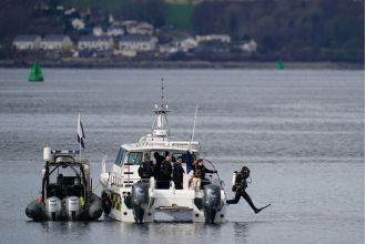 Two people have gone missing after a boat overturned in Scotland.