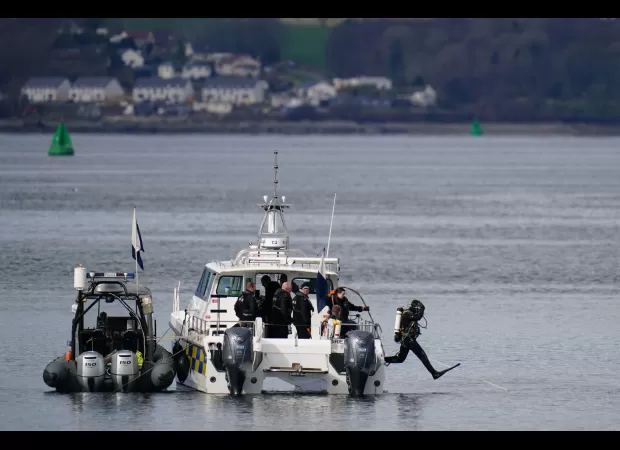 Two people have gone missing after a boat overturned in Scotland.