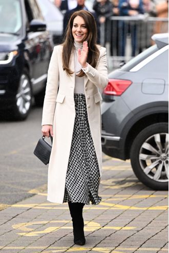 Kate Middleton looked great once more in her Zara houndstooth skirt and cream coat.