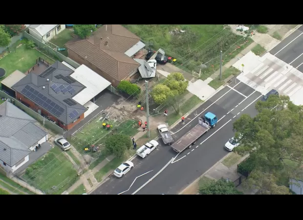 A nearby person quickly moved away as a vehicle drove through front yards.