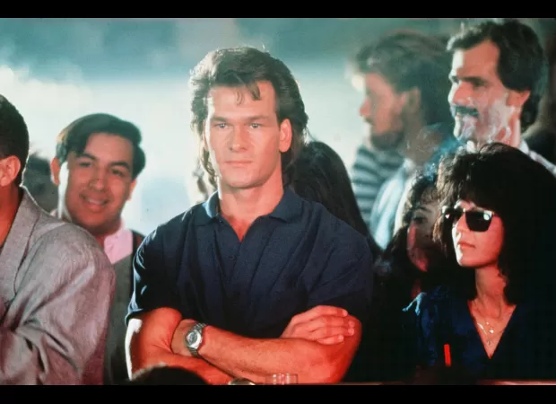 Jake Gyllenhaal showed off his toned physique as he slapped a former MMA fighter in a remake of the classic film Road House.