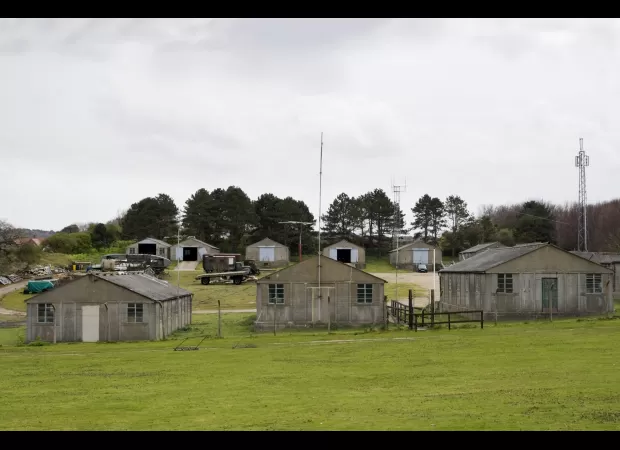 Asylum seekers to be relocated from hotels to abandoned ships & military facilities.