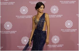 Zendaya dazzled in a sparkly sari, joined by Law Roach and Tom Holland for the NMACC Gala in India.