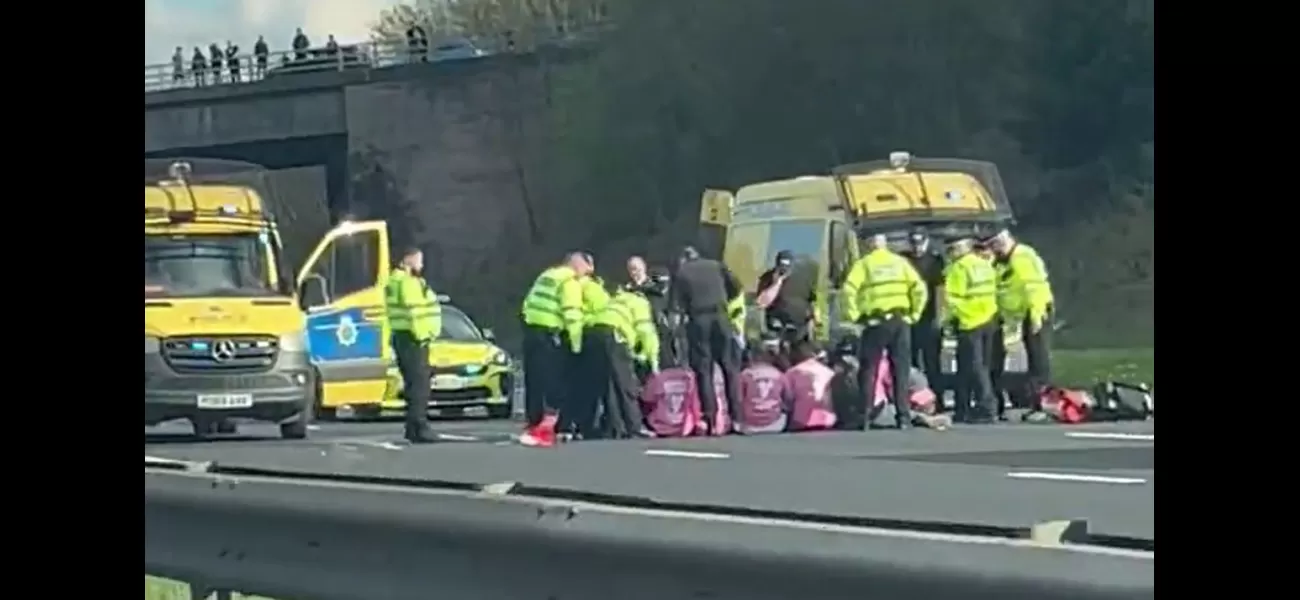 Protesters blocked M57 traffic by sitting in the middle of the road to draw attention to the Grand National.