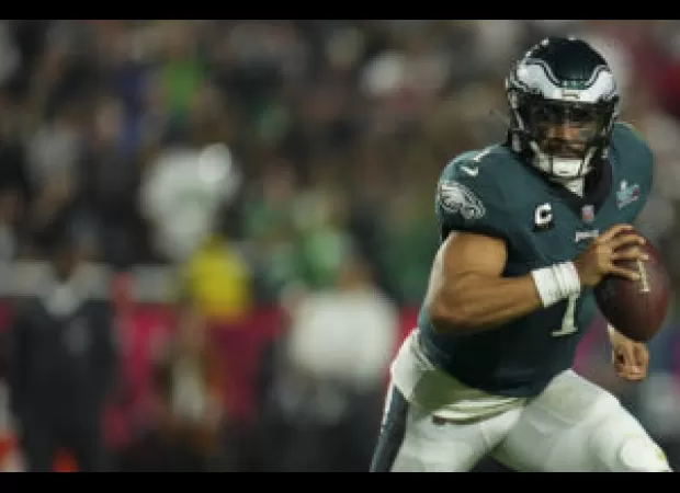 Jalen Hurts signs $255M contract extension, becoming the highest-paid NFL player ever.