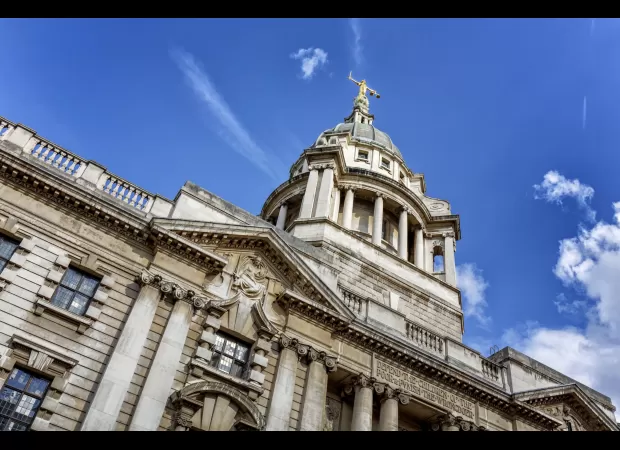 Two men confess to taking body parts, including the penis, from a man's corpse.