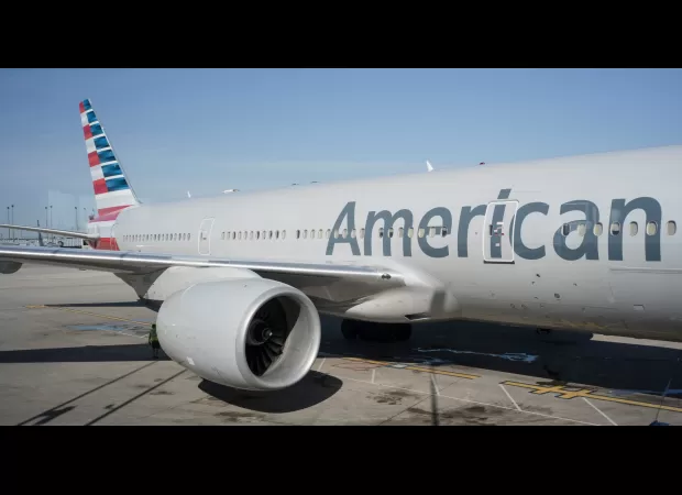 Airport employee killed after collision between service vehicle and jet bridge connecting plane to terminal.