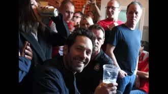 Paul Rudd joins football fans in a Wrexham pub for beers, singing, and a good time.