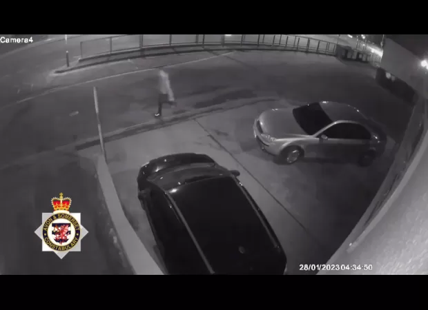 Man is seen following woman before attacking and raping her in a parking lot; surveillance video of the incident is shown.