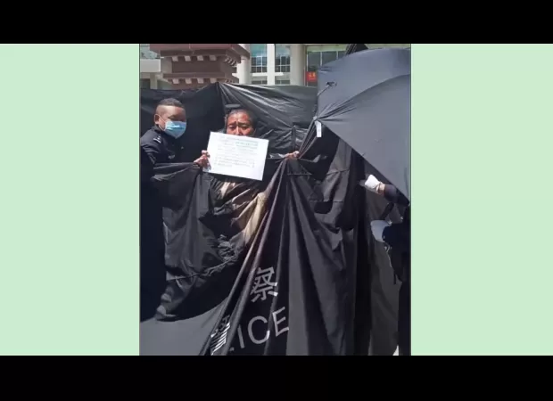 Sister of Tibetan businessman, who's in jail, was detained after taking part in a public demonstration.