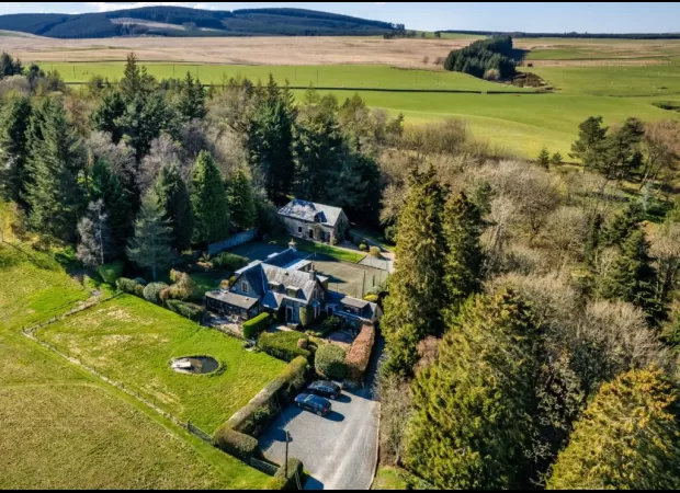 Beautiful home in Peeblesshire with native woodland and tennis court for sale.