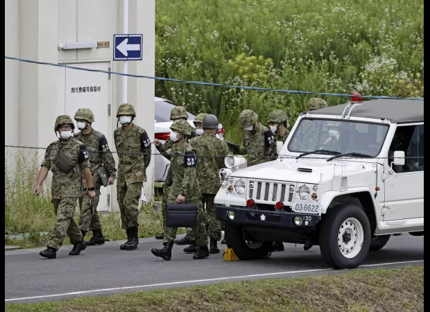 Two people killed when a Japanese cadet opened fire on fellow cadets, according to military.