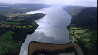 Tourists at Loch Ness reported seeing a large, dark object moving in the water, causing waves.