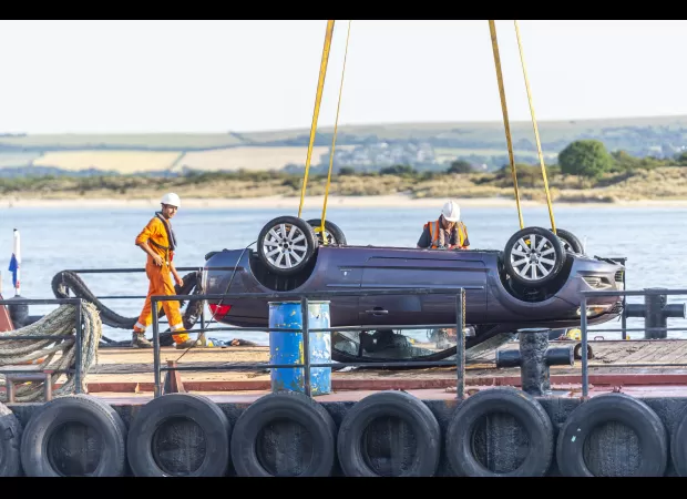 Woman drives car to get ice cream, but car accidentally rolls into the sea.