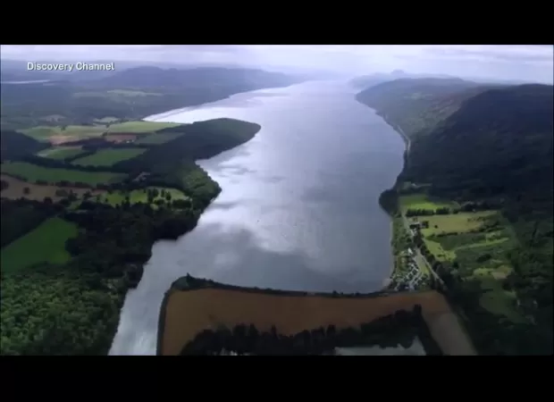 Tourists at Loch Ness reported seeing a large, dark object moving in the water, causing waves.