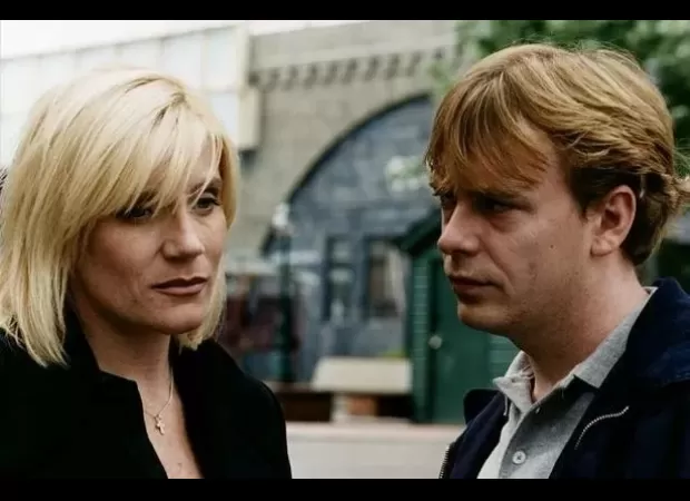 Adam & Michelle recall past disagreements on EastEnders set, now happily resolved.