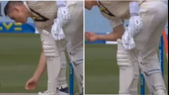 Marnus Labuschagne picks up chewing gum from the ground and puts it back in his mouth.