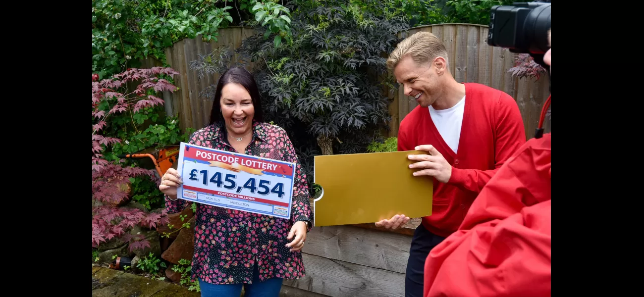 Fan of darts wins lottery and celebrates with world champion Mark Webster.