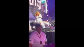 Shania Twain falls onstage in Illinois but swiftly recovers with grace.