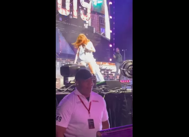 Shania Twain falls onstage in Illinois but swiftly recovers with grace.