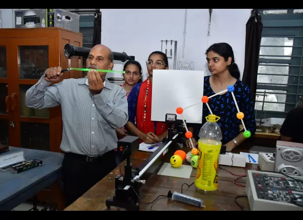 OE Award presented to professor and head of physics dept for their outstanding teaching and leadership.