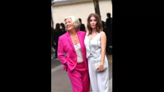 Dame Emma Thompson, 64, looked joyful in a bright suit as she playfully interacted with her 23-year-old daughter at Paris Fashion Week.
