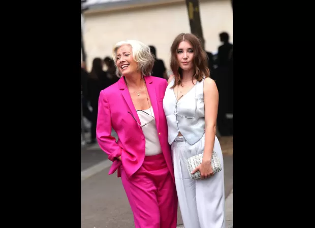 Dame Emma Thompson, 64, looked joyful in a bright suit as she playfully interacted with her 23-year-old daughter at Paris Fashion Week.