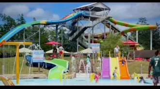 Boy, 5, soars off water slide at amusement park for thrilling ride.