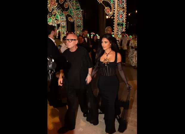 Kim channels Kourtney's black look at Italy party, amidst feud with sister.