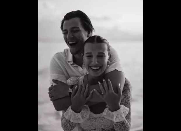 Millie Bobby Brown stuns in bridal white bikini and her fiancé Jake Bongiovi is loving it.