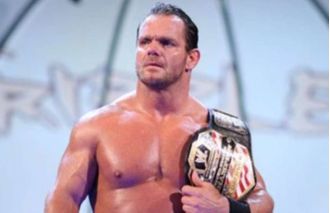 David Benoit, son of WWE wrestler Chris Benoit, sits in the front row of an AEW show 16 years after his father's double-murder suicide.
