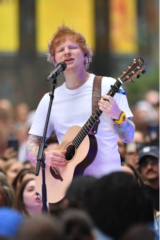 Crowd goes wild as Ed Sheeran and Eminem perform surprise duet.