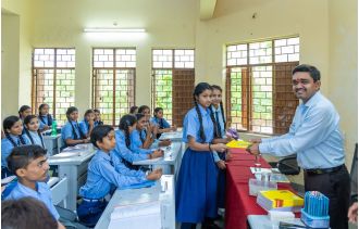 Collector Mishra taught students in a school in Madhya Pradesh.