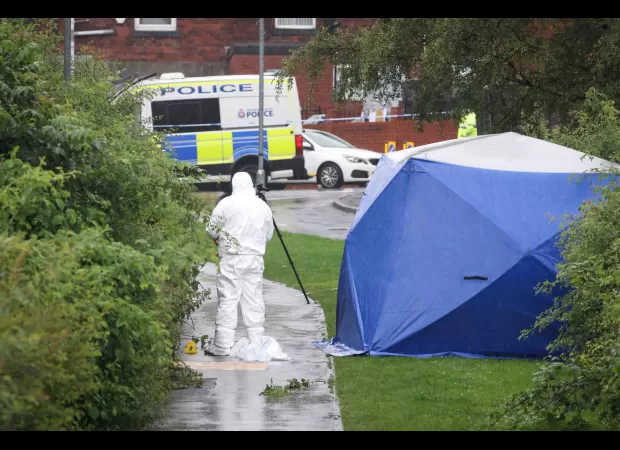 A woman in her 40s was found dead on a footpath close to a primary school.