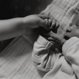 Karlie Kloss shares cute baby pics and reveals the name of her newborn.