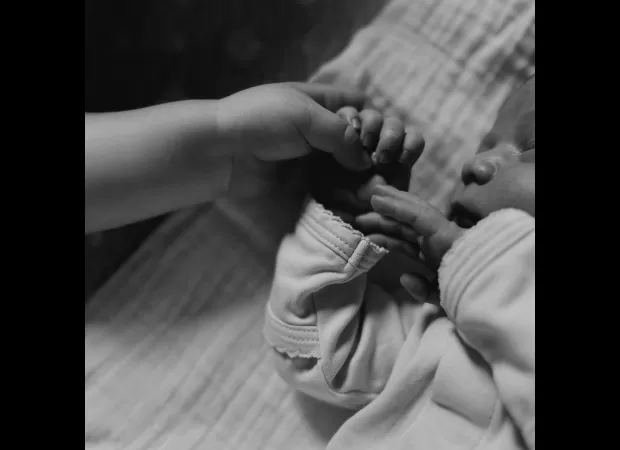 Karlie Kloss shares cute baby pics and reveals the name of her newborn.