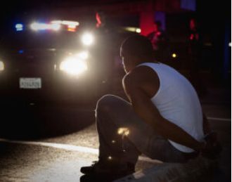 Officer charged with violating civil rights after assaulting Black man in custody.