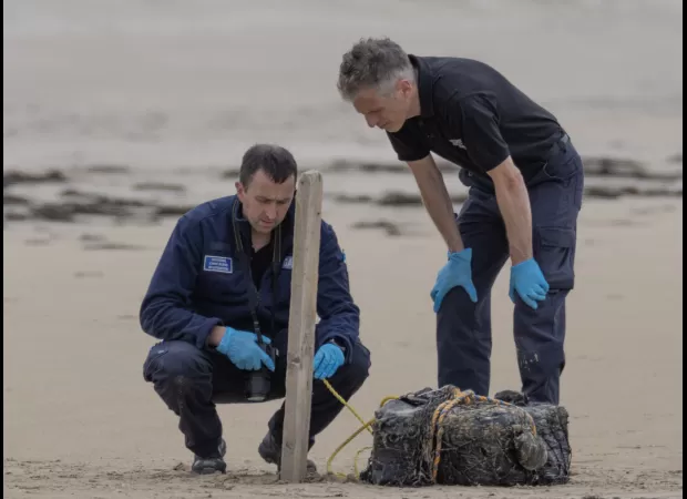 Youths comb coast of Ireland after cocaine washes up on beach.