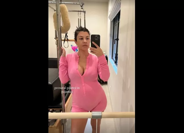 Kourtney Kardashian wears a stylish Barbie pink outfit for her pregnancy workout.