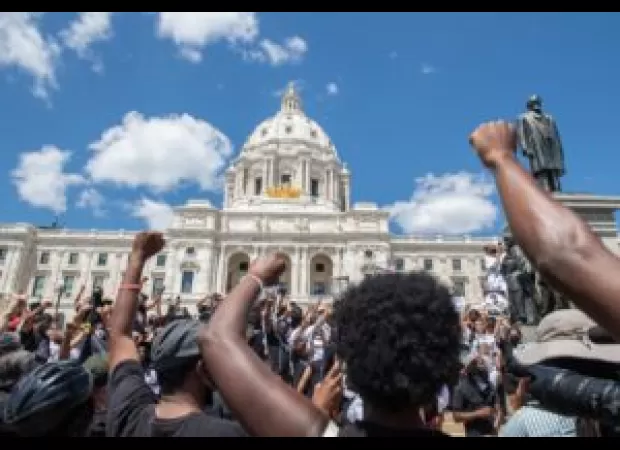 Charges dropped against white woman who spat on Black Lives Matter protestor.