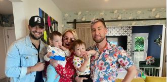 Britney meets Lance's babies and cuddles them in a joyous snap.