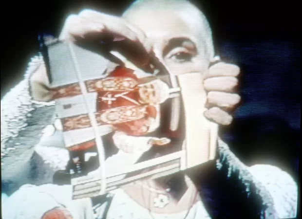 Fans pay tribute to Sinéad O’Connor's courage, remembering her iconic moment of ripping up the Pope's photo on SNL after her death at 56.
