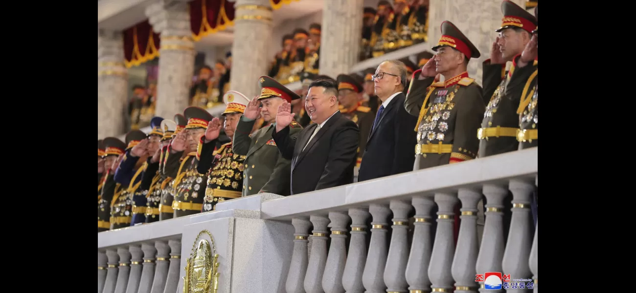 Kim & Putin's defence chief laugh as nukes roll by at military parade.