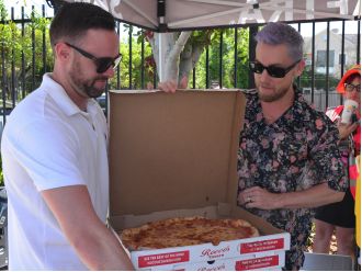 Lance Bass shows solidarity with SAG-AFTRA by bringing pizza to actors striking for better wages.