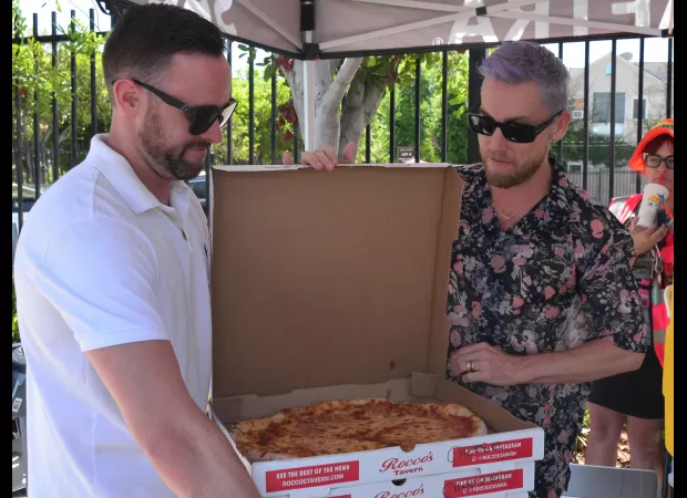 Lance Bass shows solidarity with SAG-AFTRA by bringing pizza to actors striking for better wages.