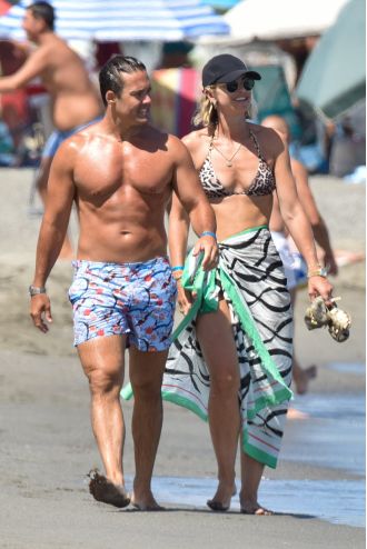 Vogue Williams enjoys the Spanish sun in her leopard print bikini with her family.