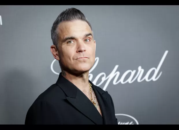 Robbie Williams seeks fillers to plump face after weight loss.